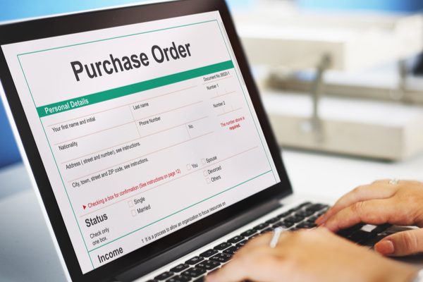 Staff filling out purchase orders
